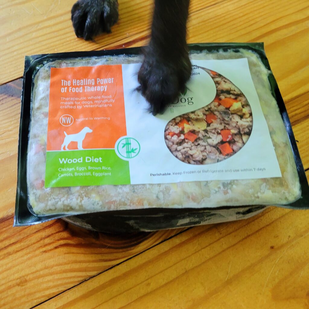 black dog paw on a package of Chi Dog food