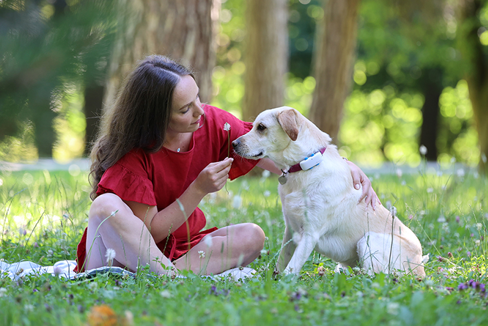 dog mom with dog wearing a GPS tracker for pets