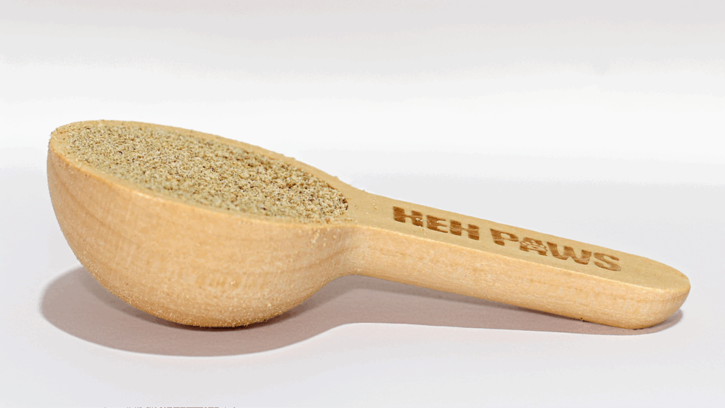 Wooden scoop of HEH Paws dog supplement.