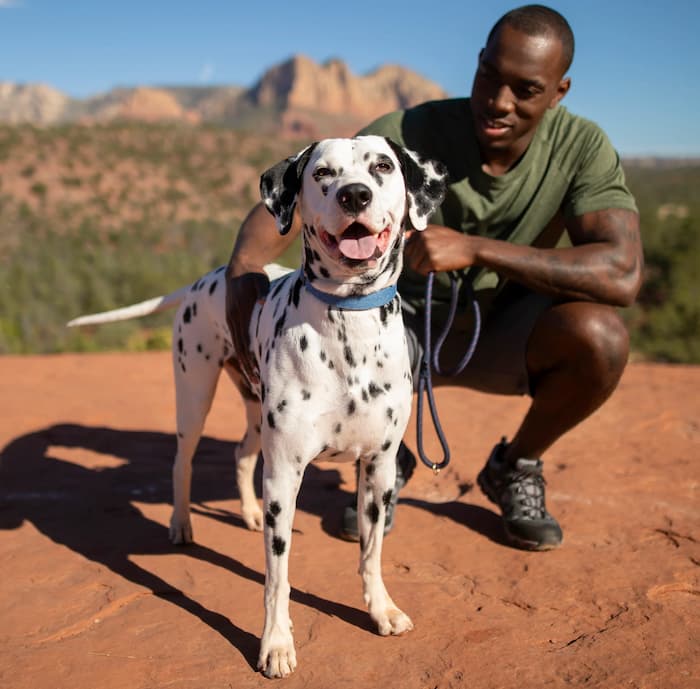Man with dog outside
