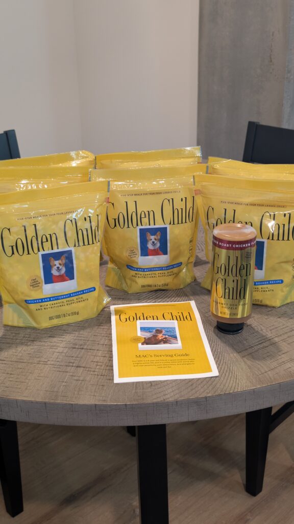 Golden Child sample pack with fresh-frozen Main pouches, a Golden Roast Chicken Drizzle, and a personalized serving guide