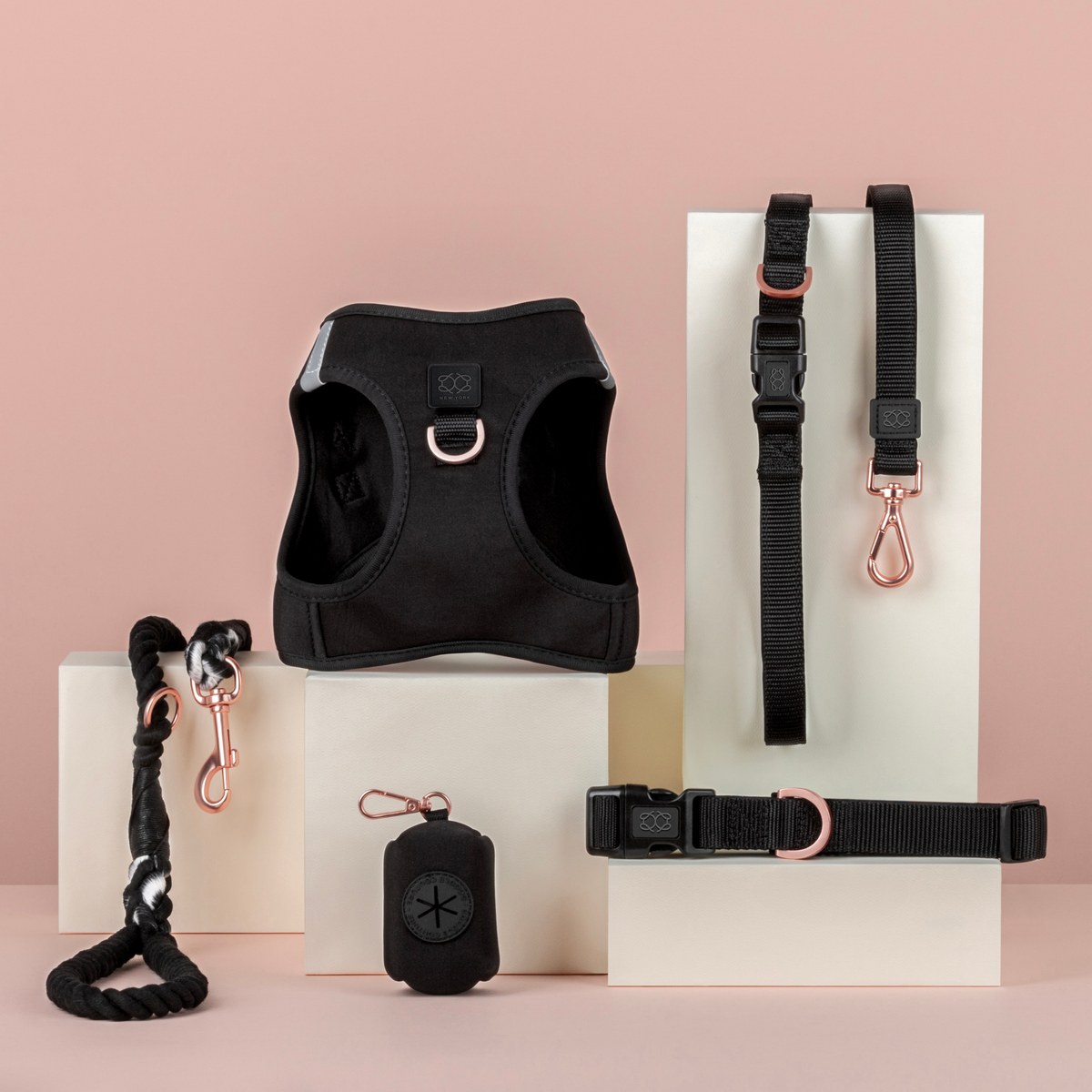 DOGISTRY harness, collars, and leashes collection displayed with rose gold hardware