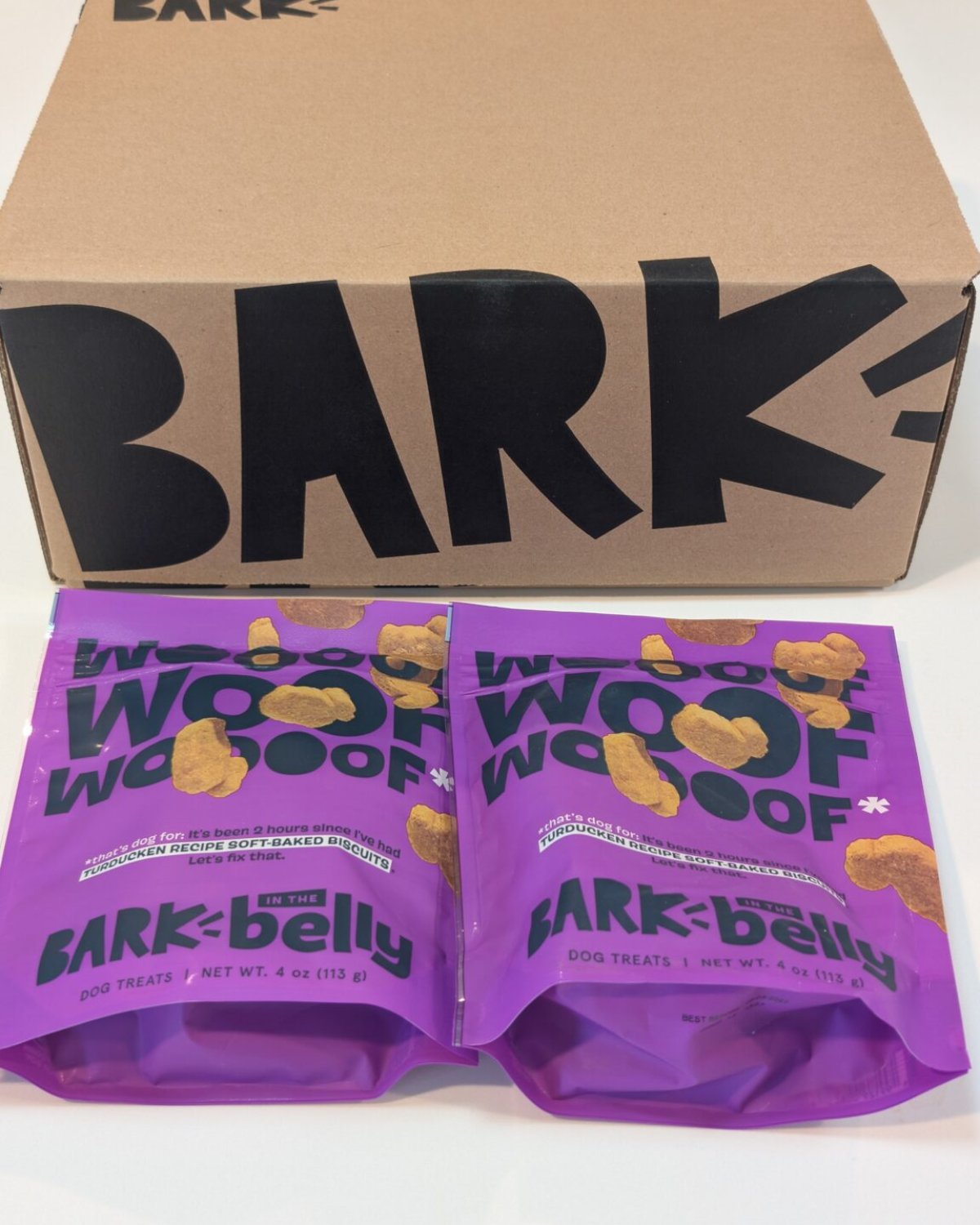 BARK shipping carton with two soft-baked treat bags from the BARK x Flavortown box
