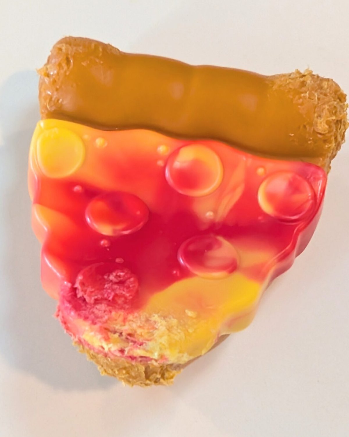 BarkBox pizza slice plush toy with molded crust and glossy sauce bubbles